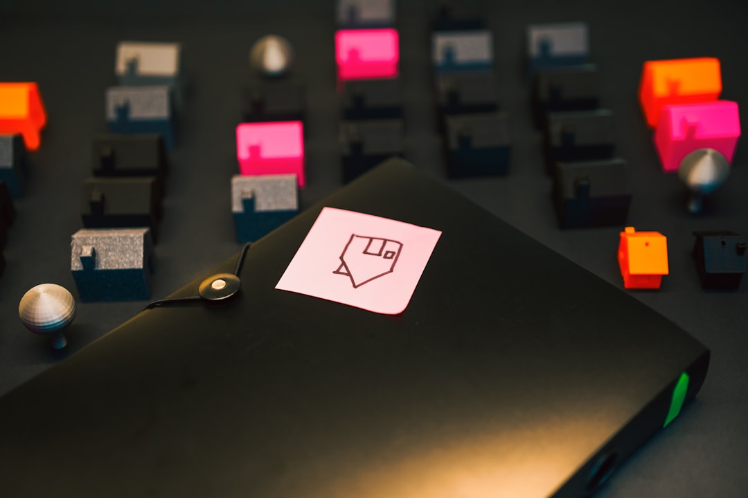 miniature houses model of the estate folder with housing loan documents pink sticky mote home picture